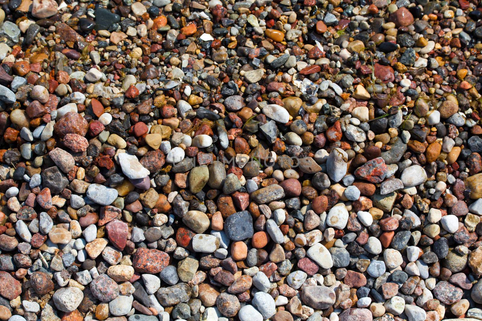 Close up of rounded and polished beach rocks
