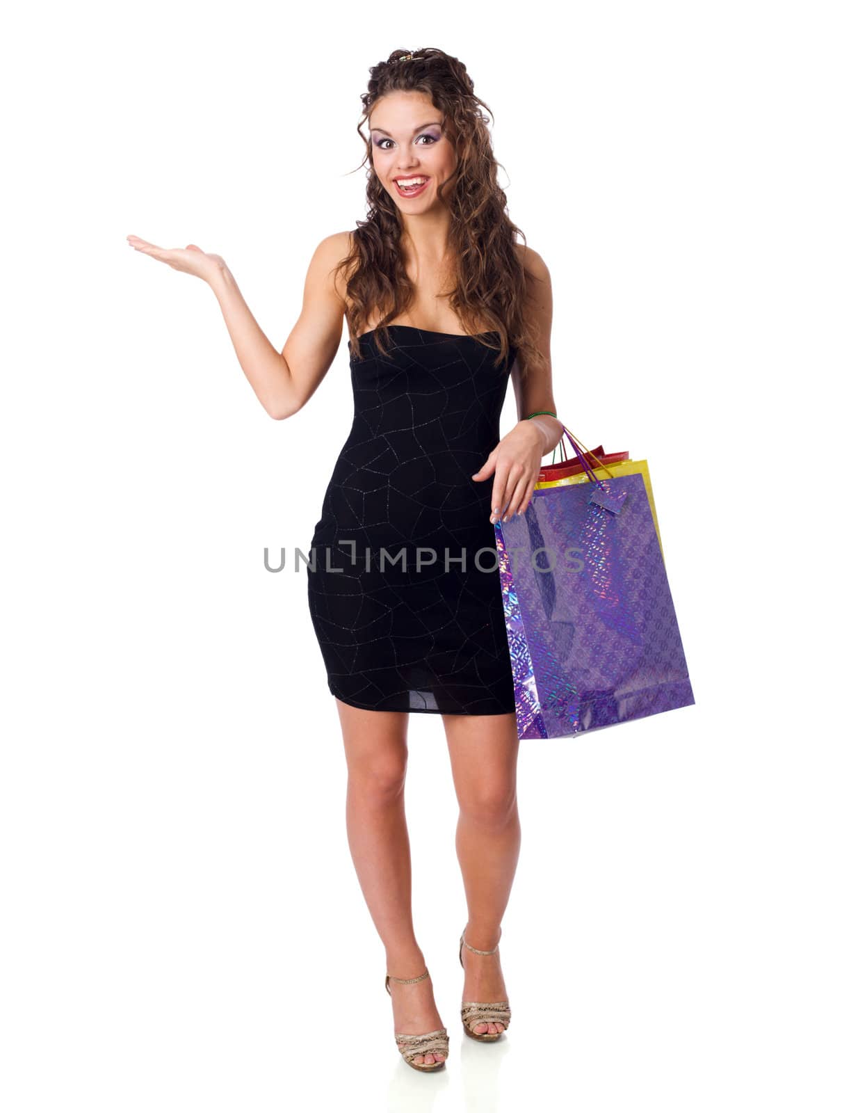 Young Woman shopping holding bags isolated on white