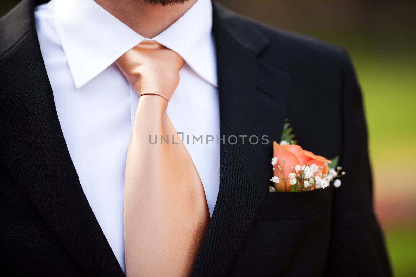 buttonhole with rose detail of groom's wedding dressup