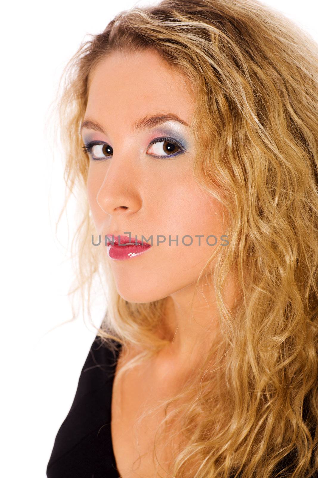 Closeup portrait of young blond woman with curly hair 