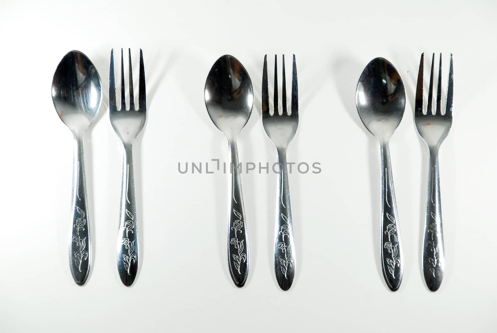 Spoon shine on a white background