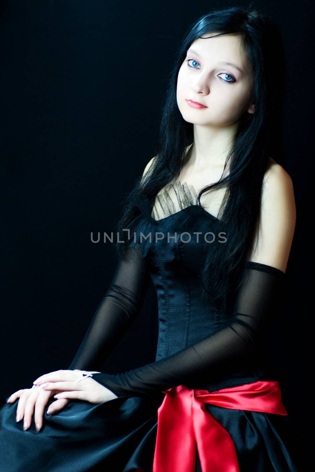 Portrait of serene Gothic Girl over dark background