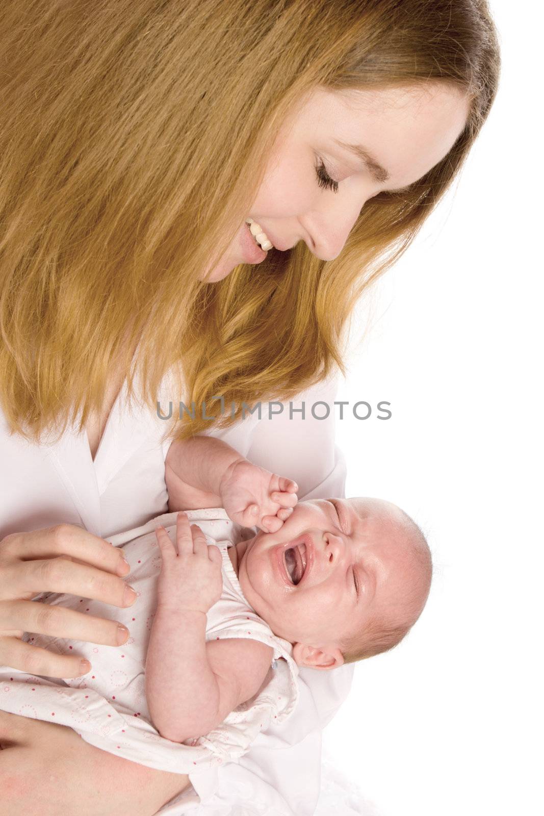 Happy mother holding her crying  baby isolated