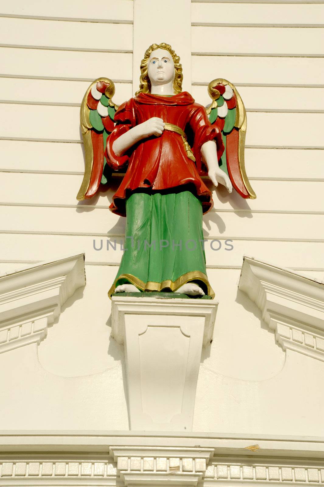 Wooden figure on the fasde old house in Bergen, Norway