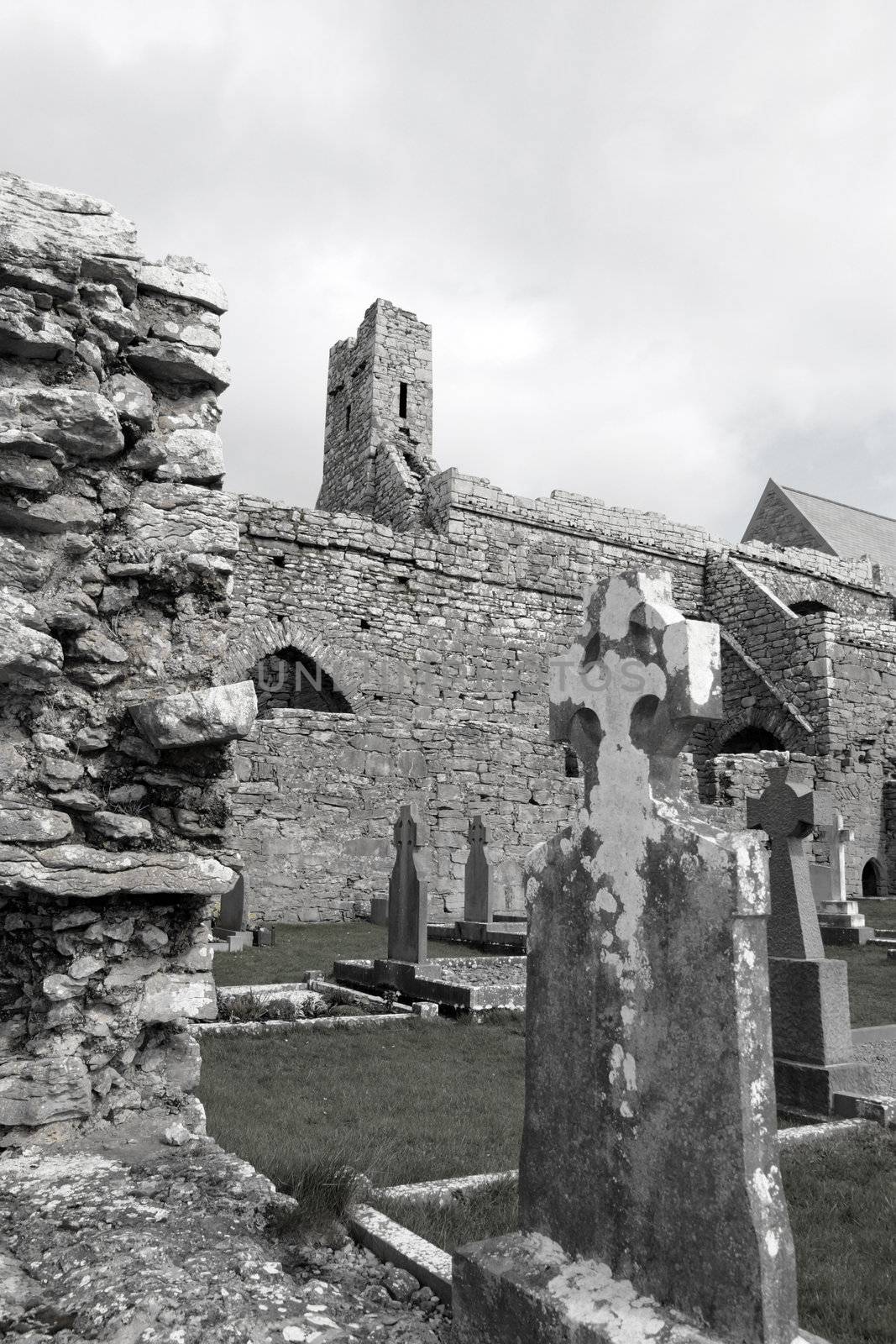 ancient celtic crosses in the graveyard of an old irish church