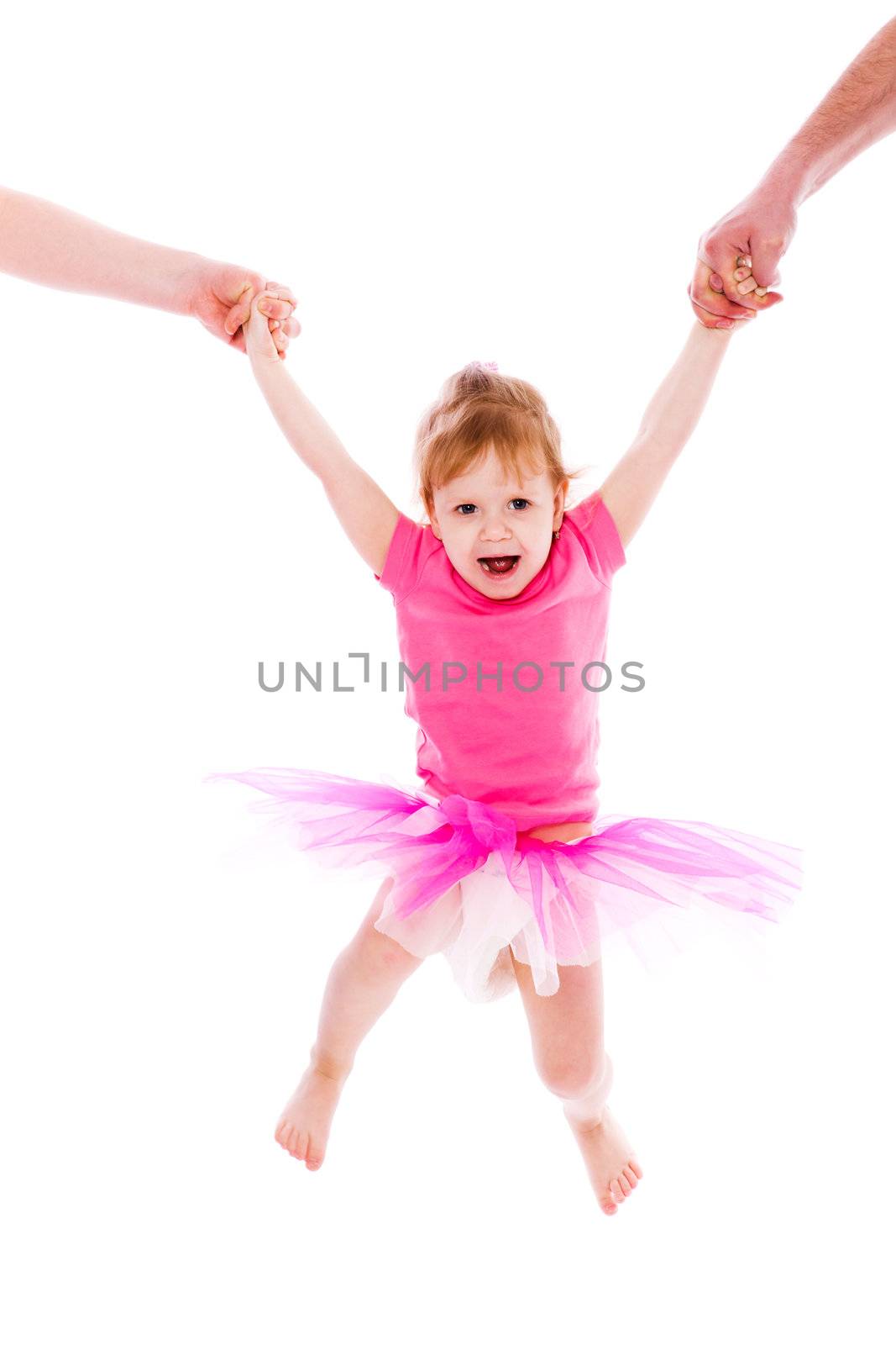 Little laughing girl hanging on parent's hands isolated