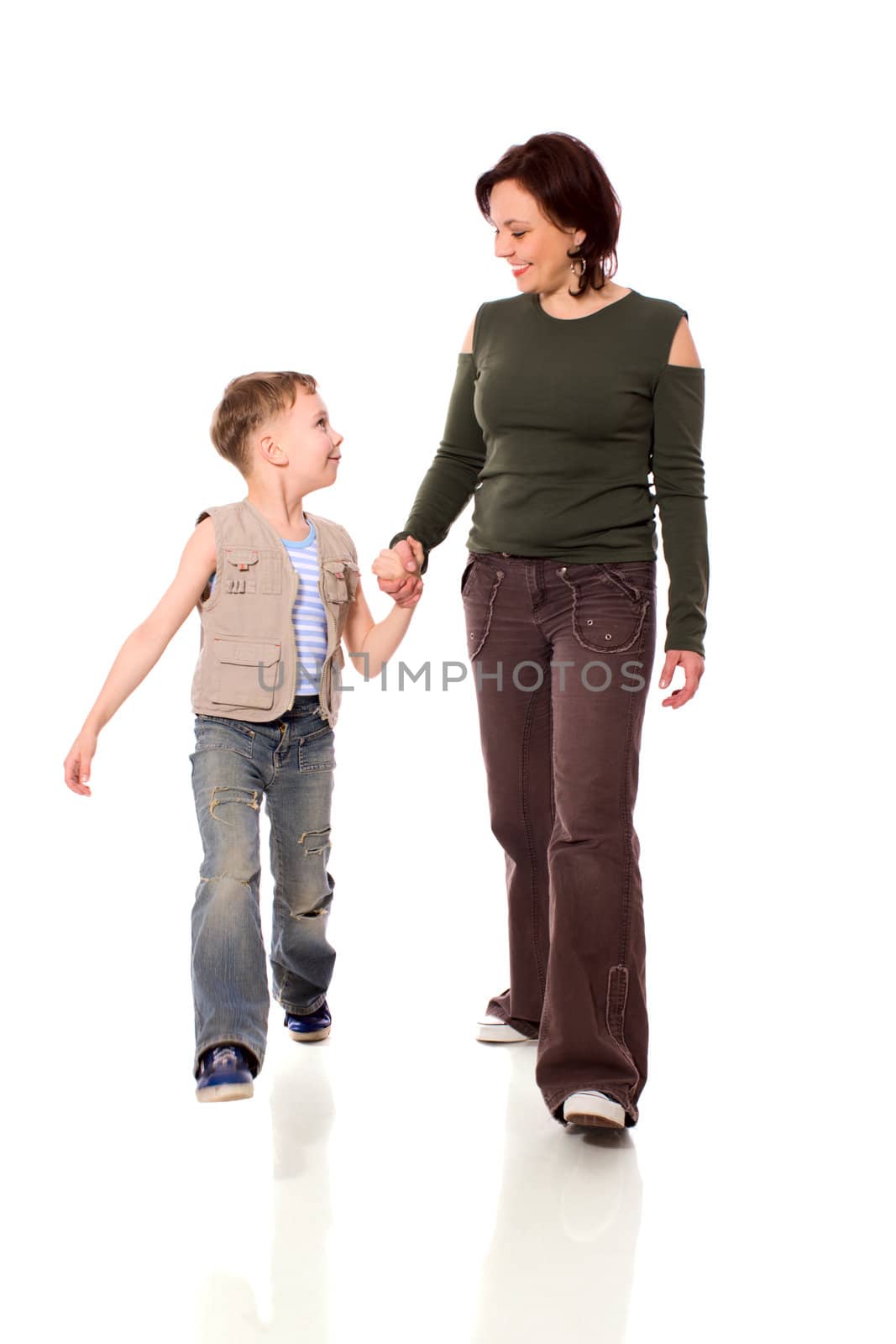 Mother and son walking together isolated on white