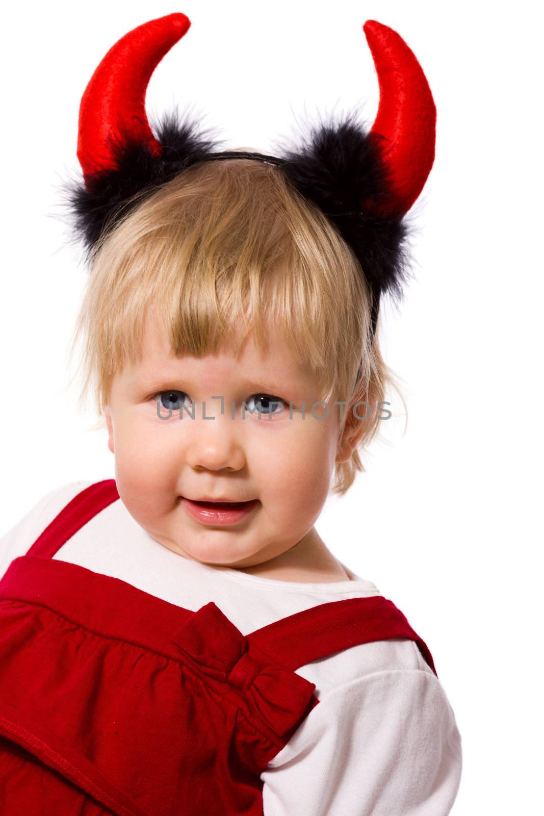 Portrait of little girl wearing devil's horns isolated