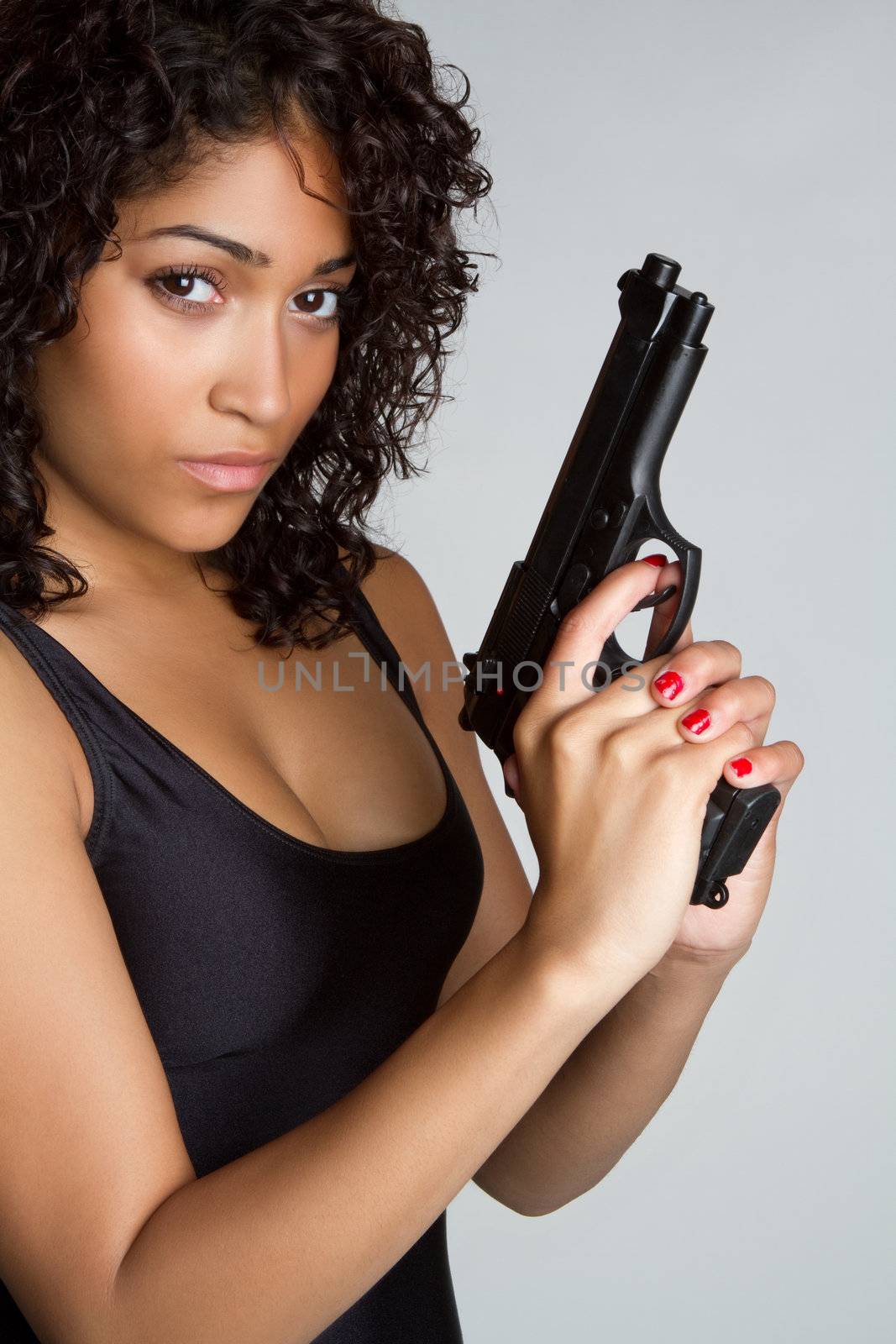 Beautiful black woman holding gun