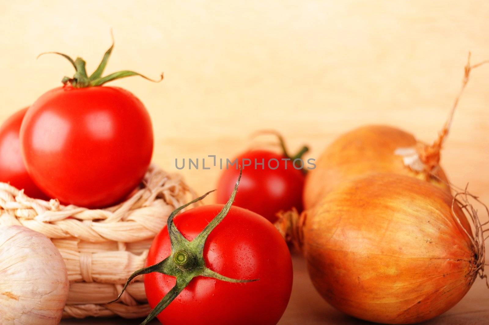 tomatoes and garlic in kitchen showing healthy food concept