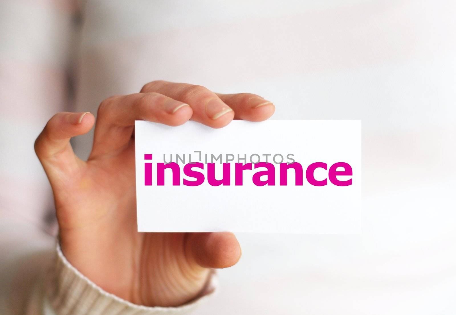 insurance concept with hand word an paper