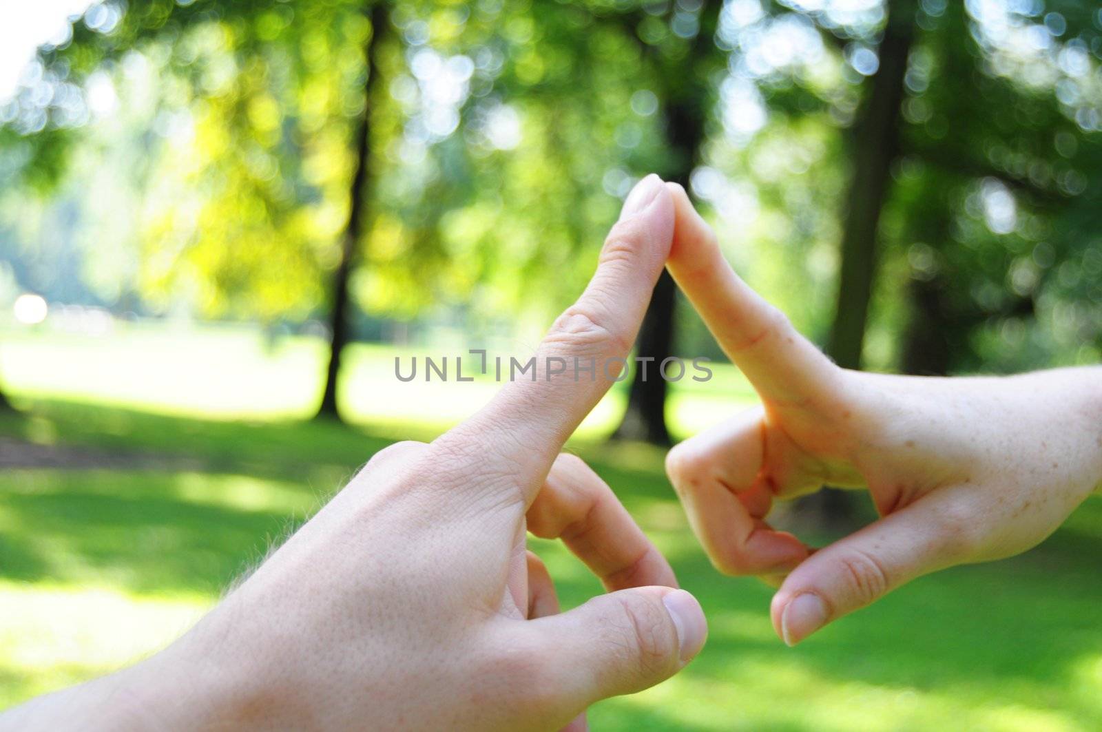 love concept with hands fingers and copyspace in nature