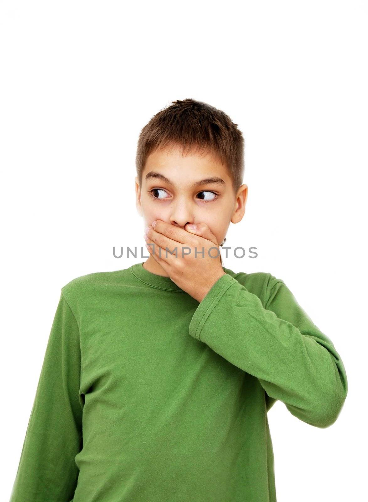 caucasian teenage boy covering his mouth by hand, isolated over white background
