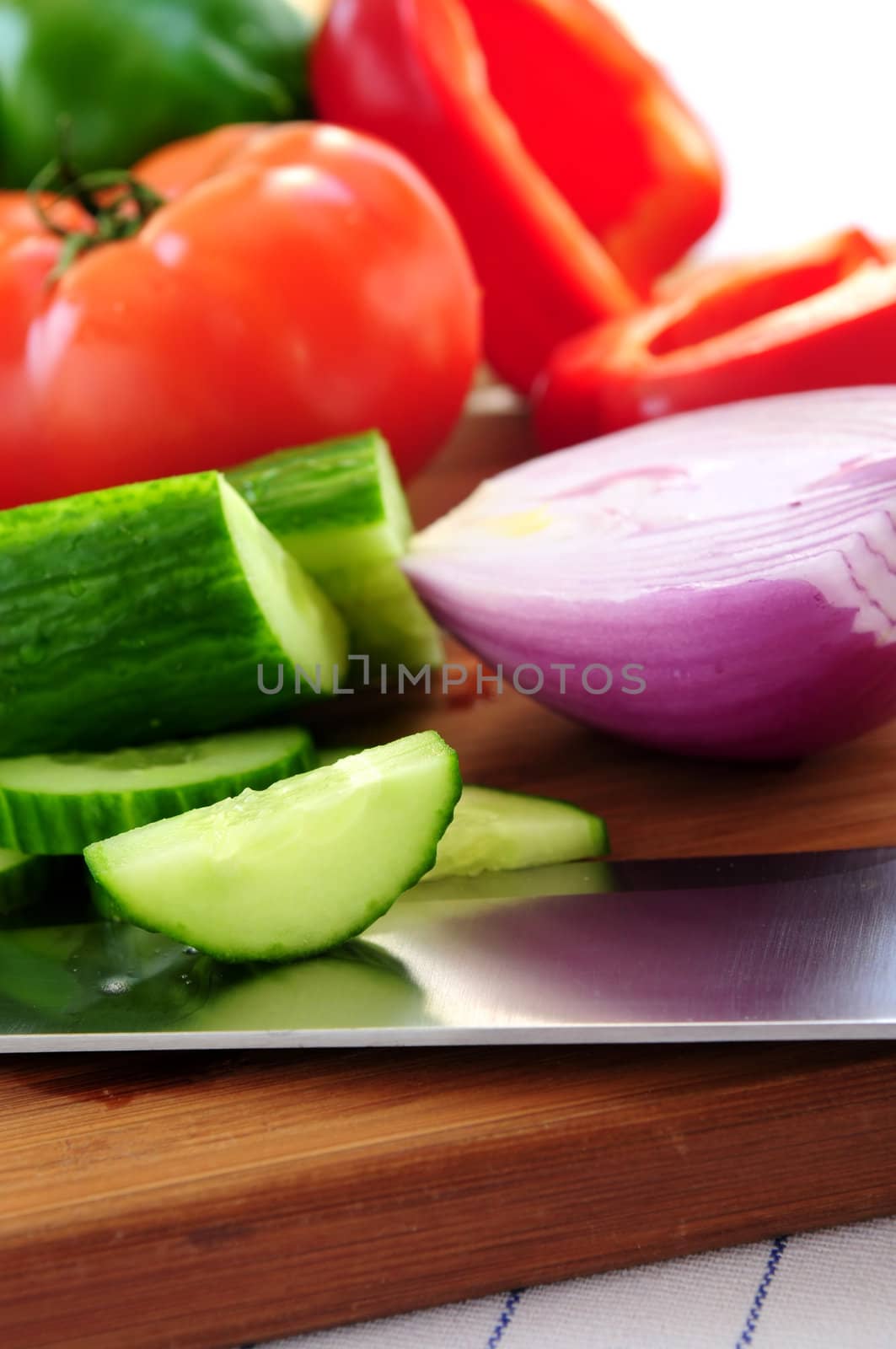 Fresh garden vegetables on cutting board - ingredients for a salad