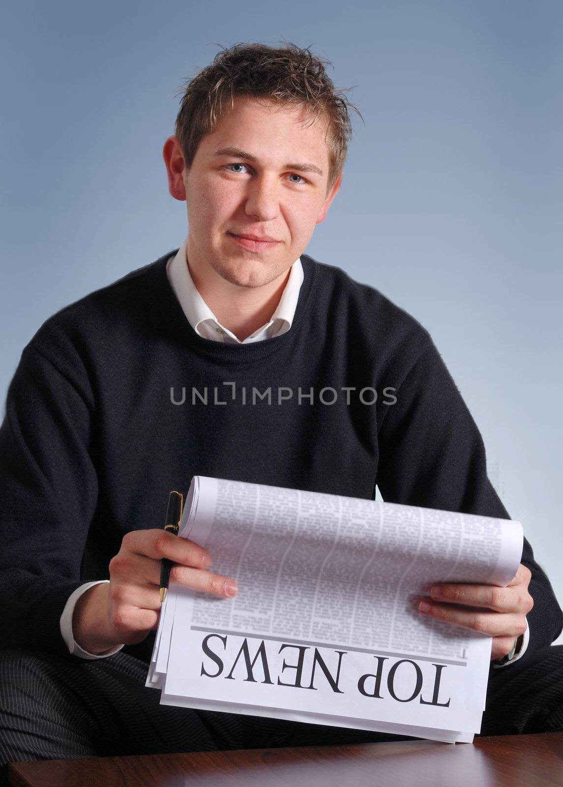 businessman reading top news on newspaper