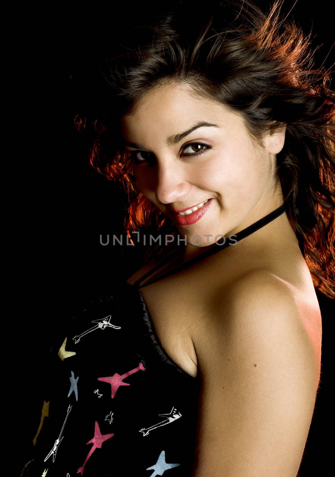 Portrait of a beautiful young and attractive woman on a black background