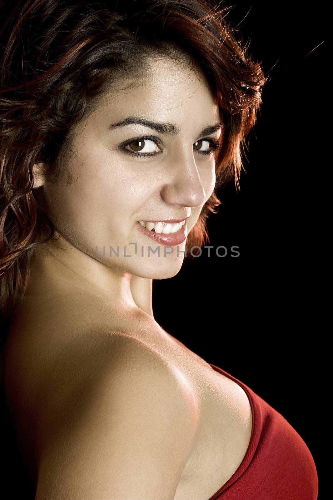 Portrait of a beautiful young and attractive woman on a black background