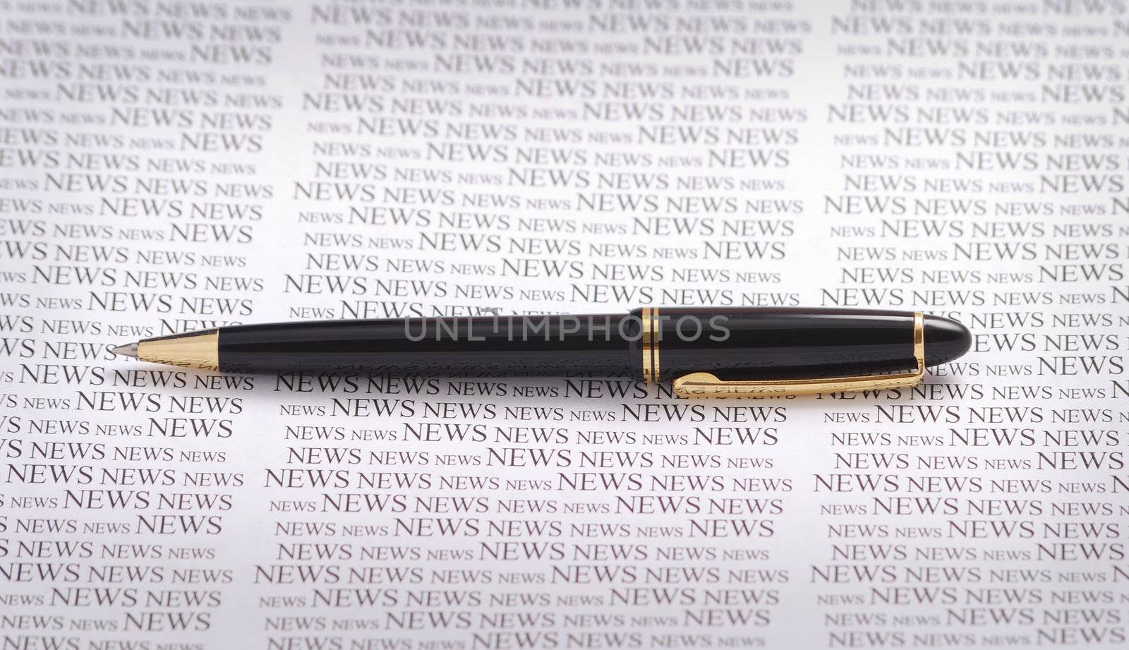smart pen on news patterned  backgound. 