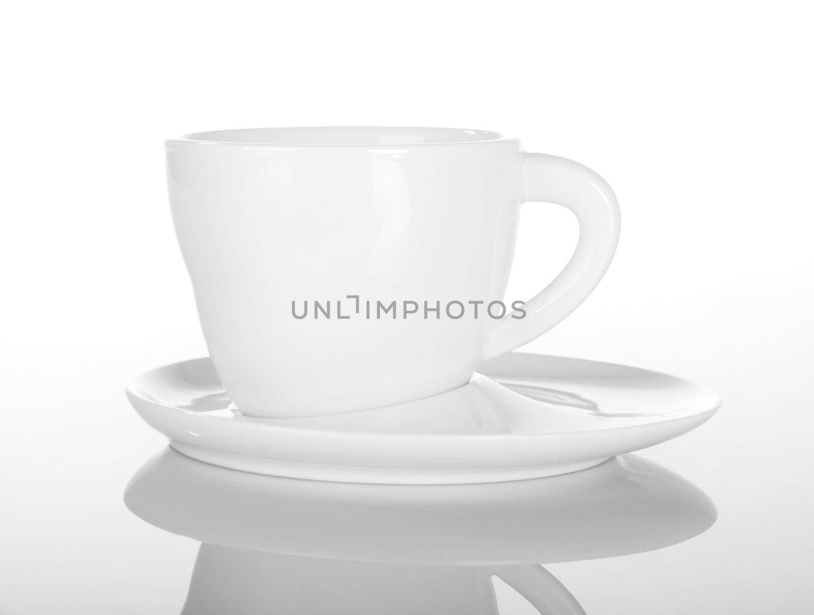 Empty cup of tea on white with reflection