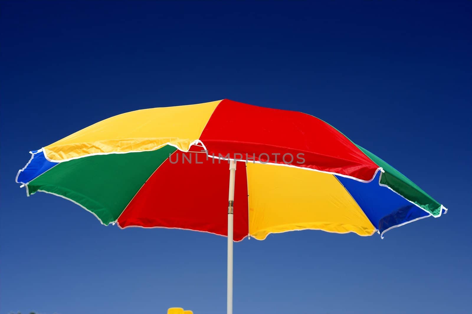 beach umbrella and deep blue sky