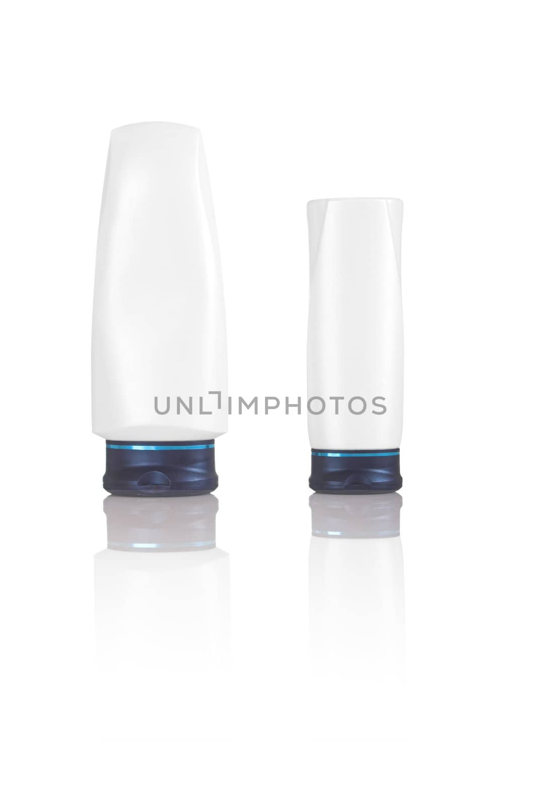 Two white cosmetics bottles with reflection on white
