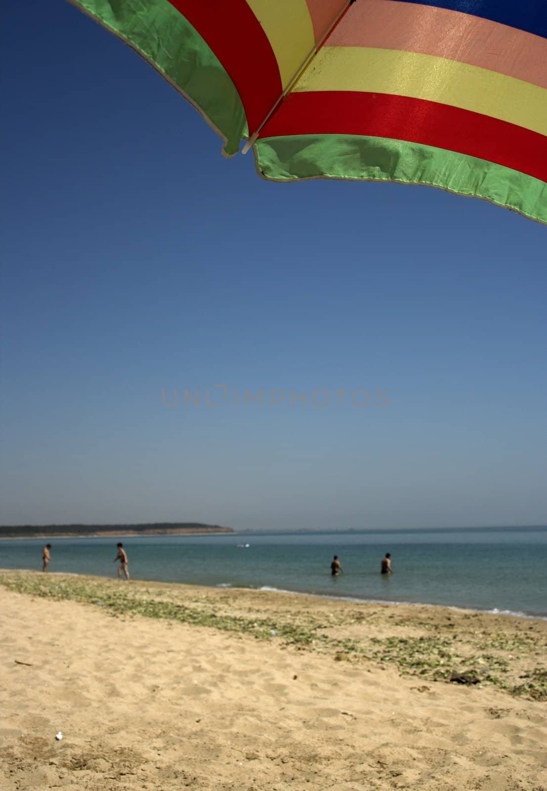 beach umbrella and deep blue sky