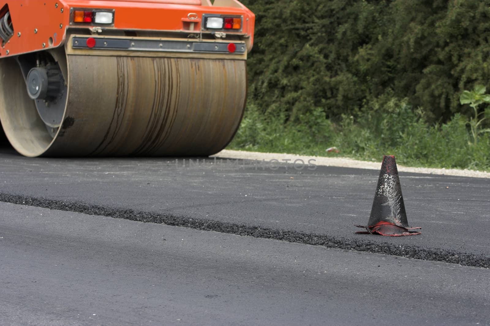 Traffic cone and road roller
