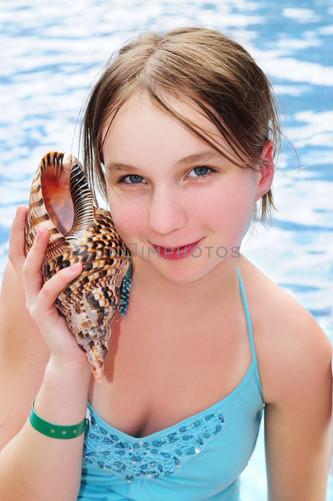 Young girl with seashell by elenathewise