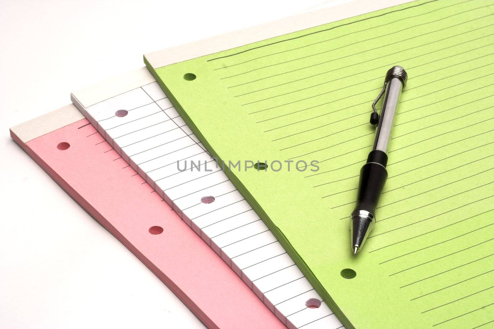 Colored blank notebooks over white