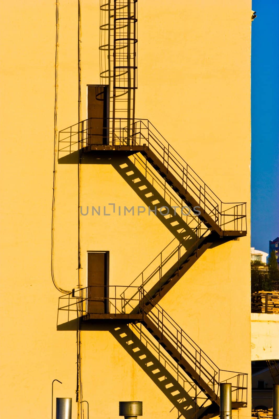 architecture series: steel stairs and it shadow on the wall