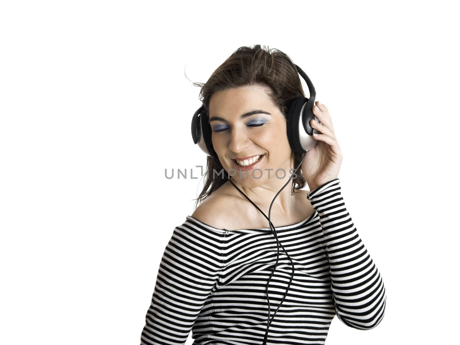 Beautiful young woman listening music with headphones isolated on white backgroun