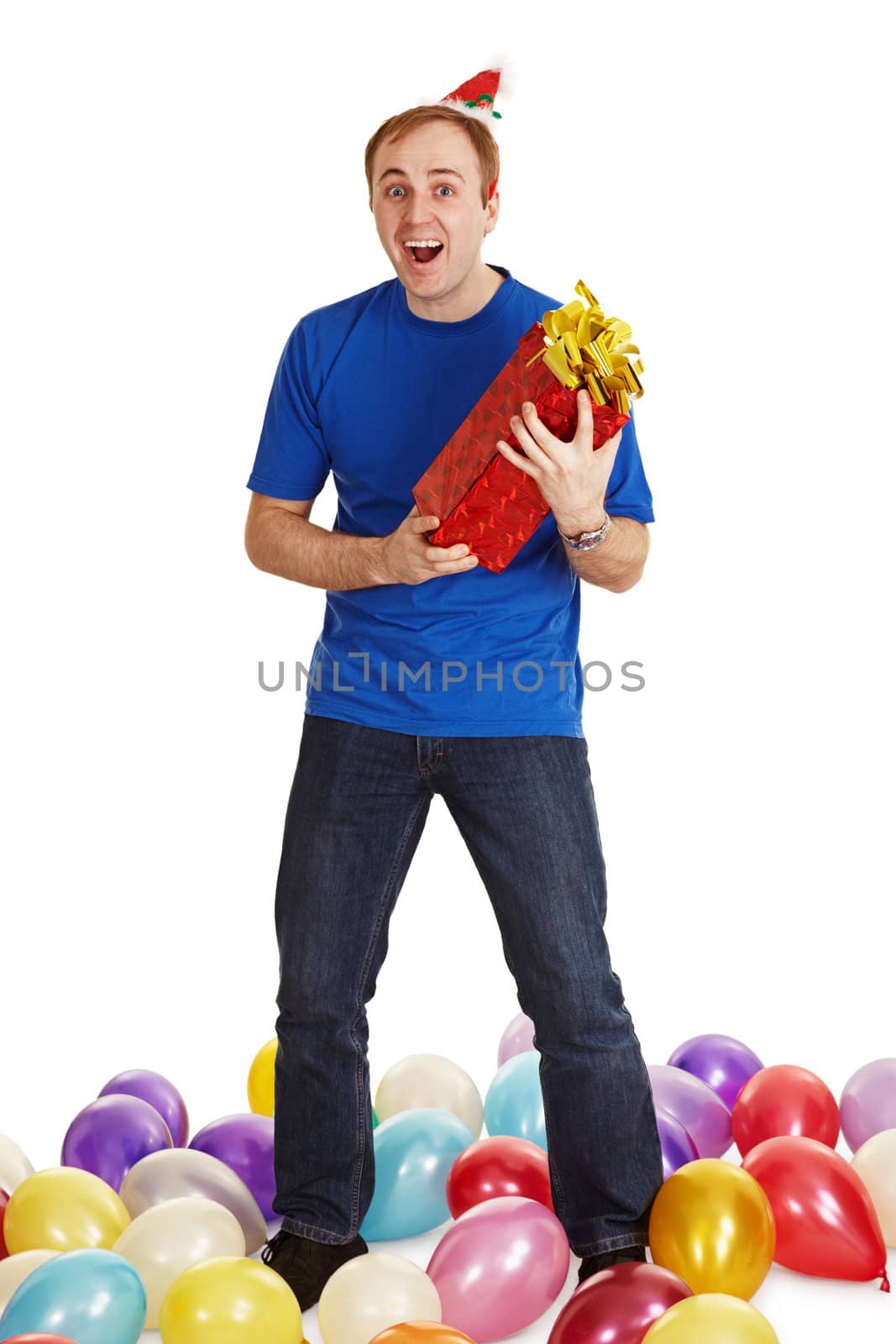 The cheerful man with a New Year's gift in hands isolated on a white background