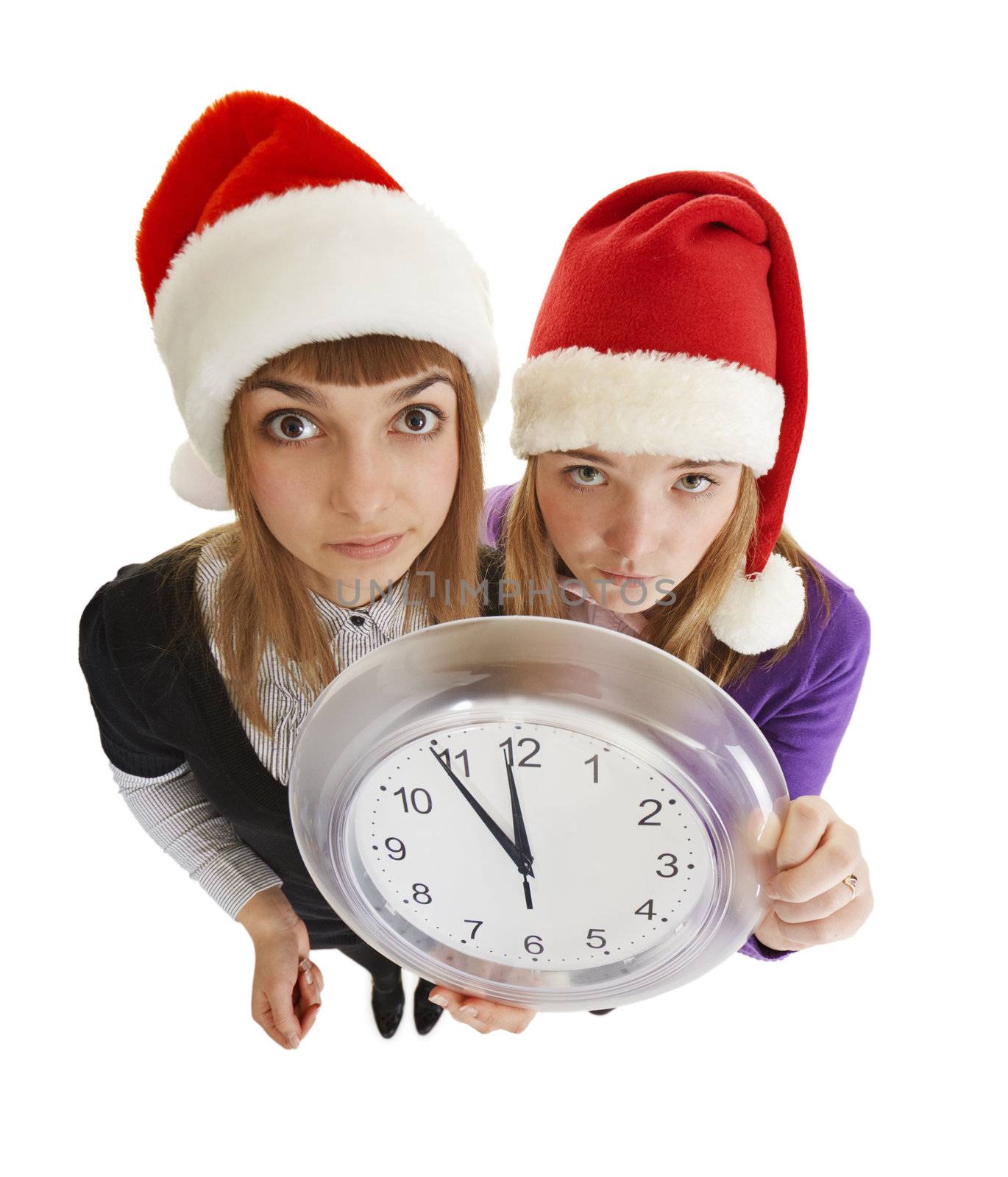 Two girls are ready to greet the new year with a watch in his hand isolated on a white background