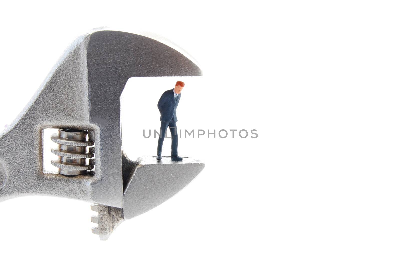 tiny business man with caliper showing concept for stress at work