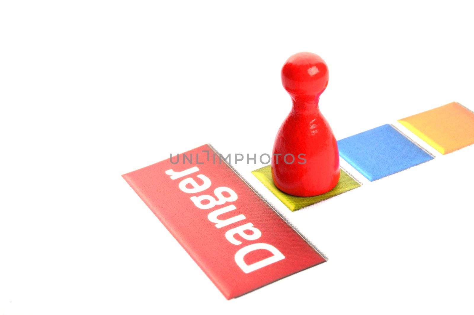 danger or risk ahead concept with pawn in white