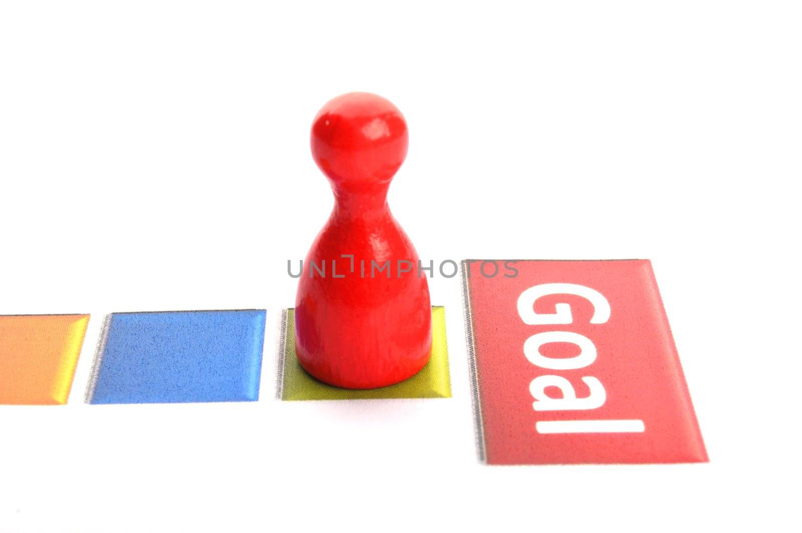 business goal concept with word and game pawn