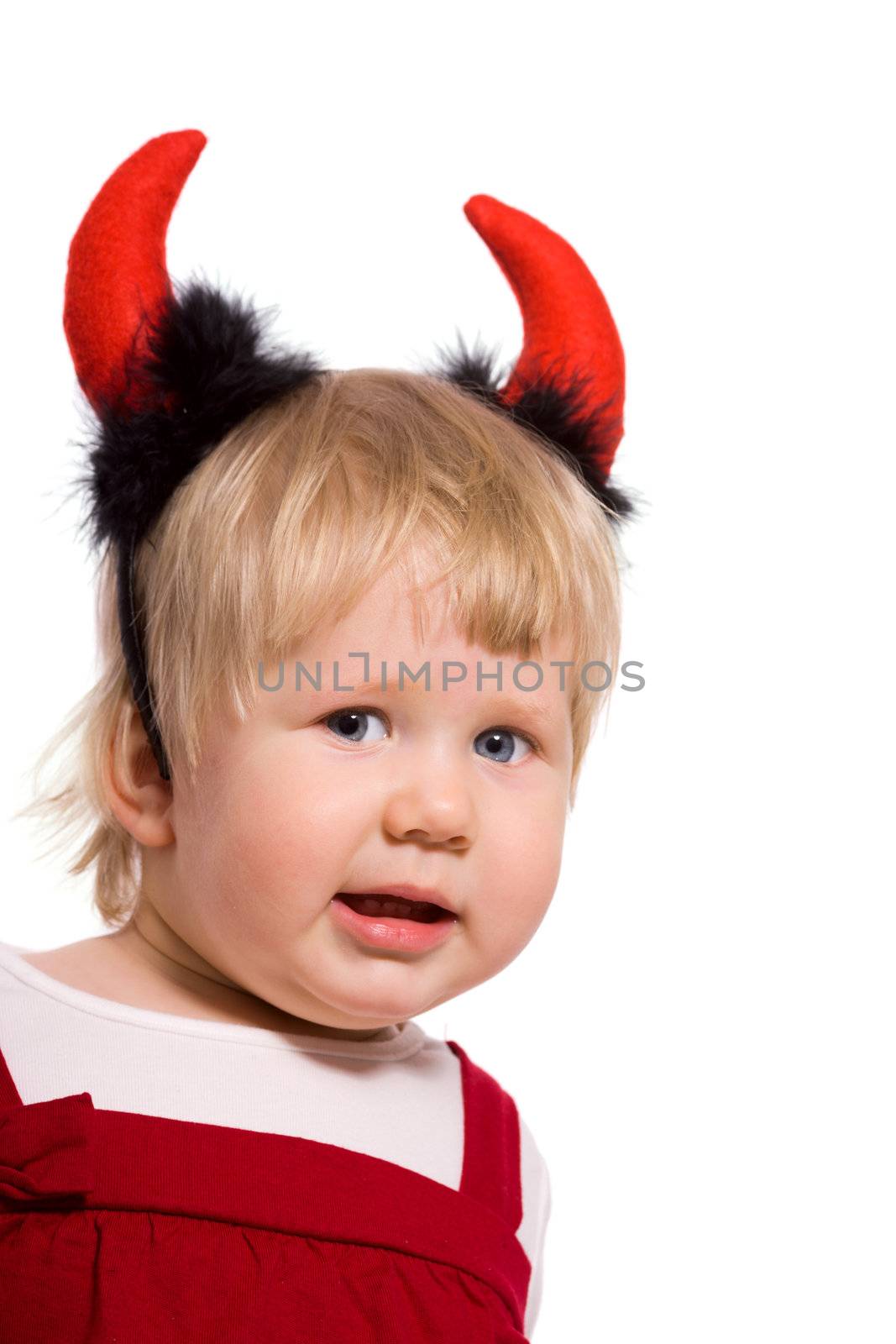 Portrait of little girl wearing devil's horns isolated