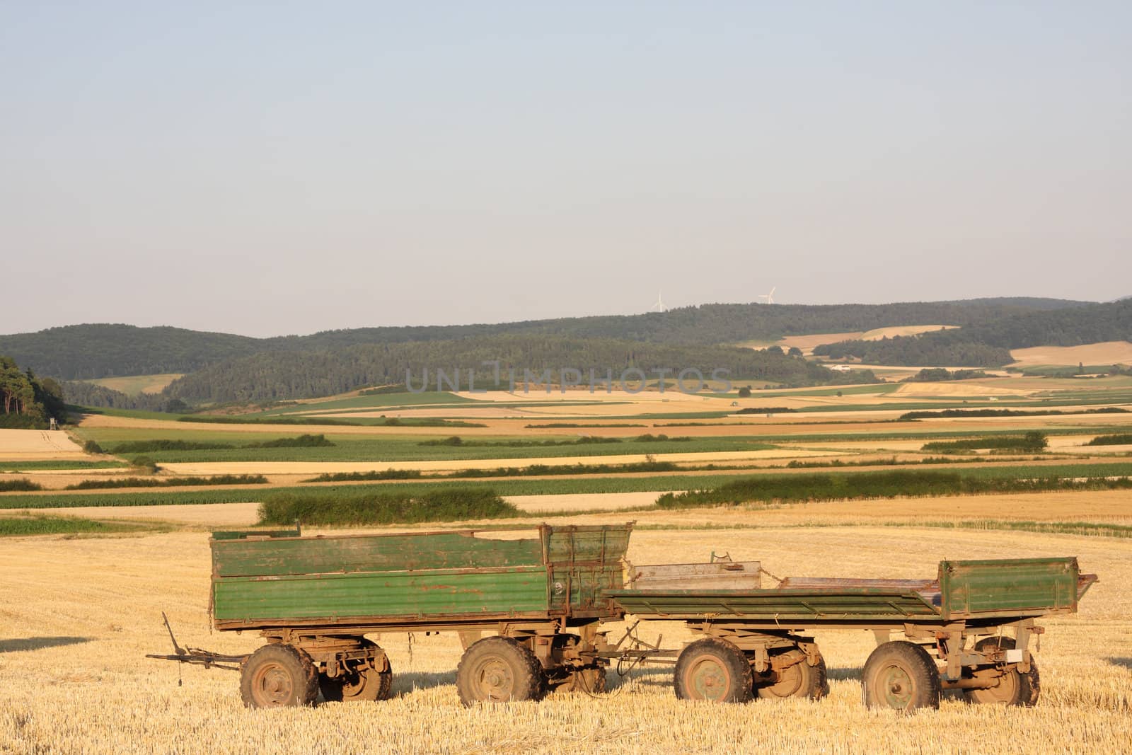 empty trailers on harvested field