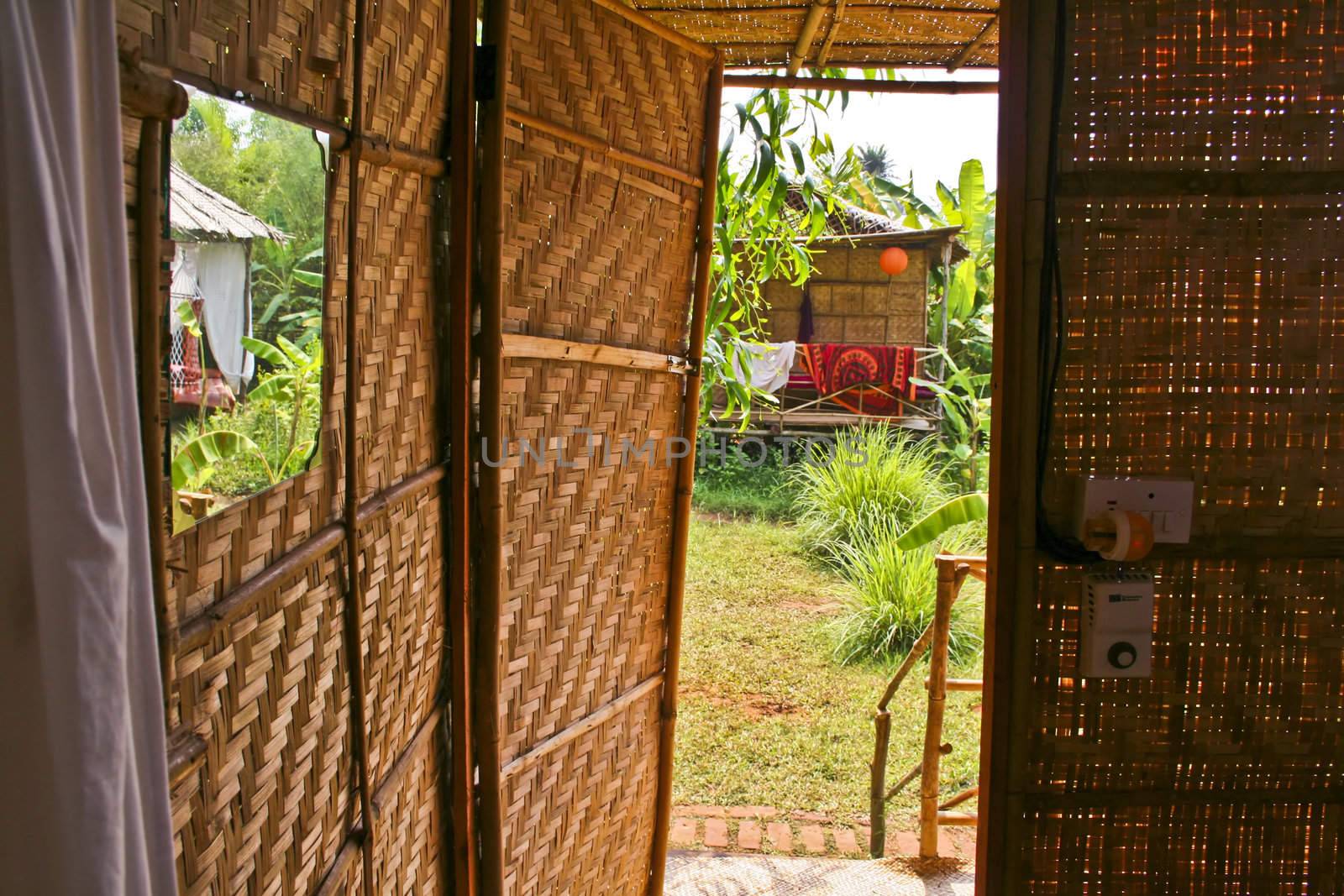 view of nice exotic bamboo hut in tropical village