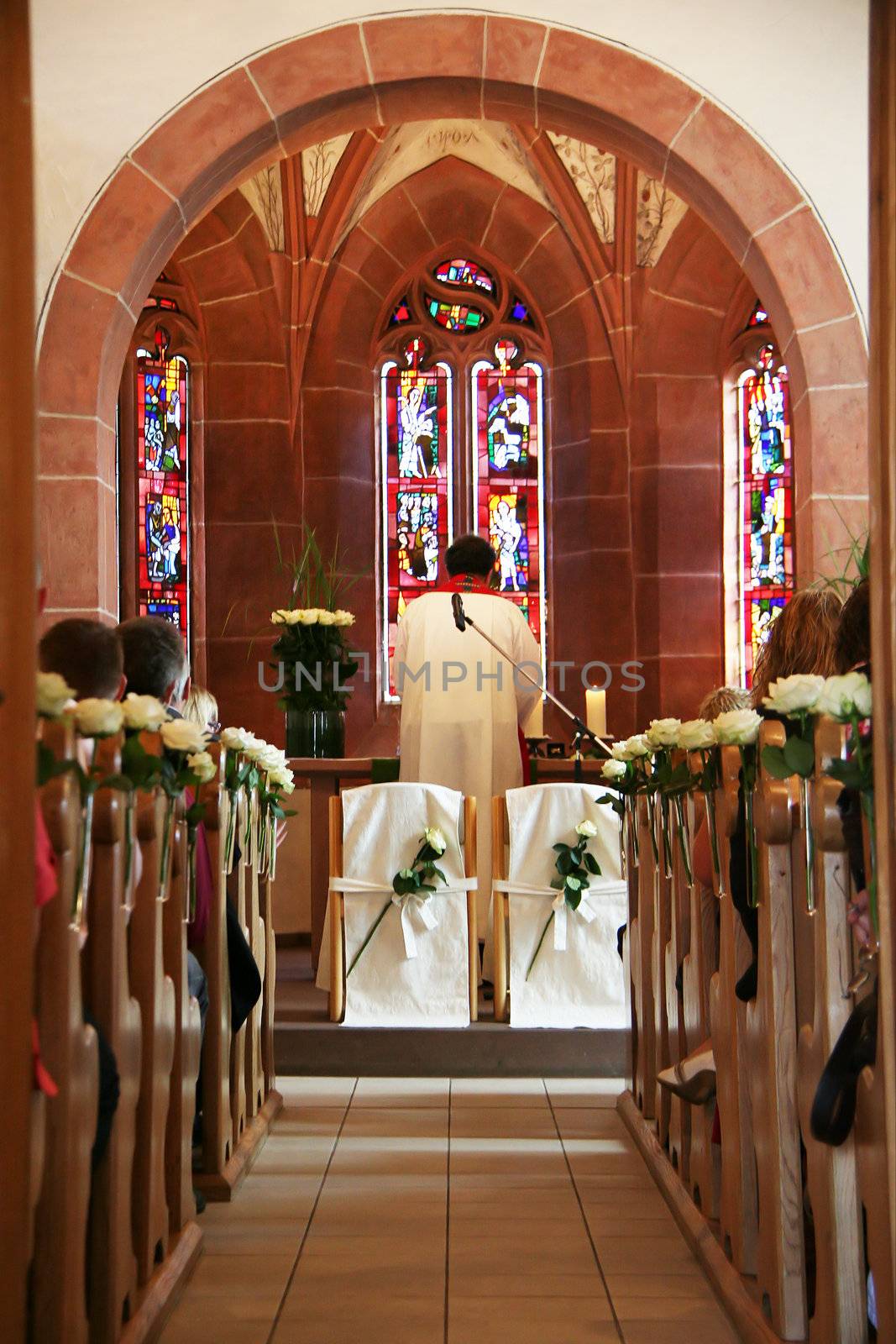 Seats on the altar of a wooden wedding church