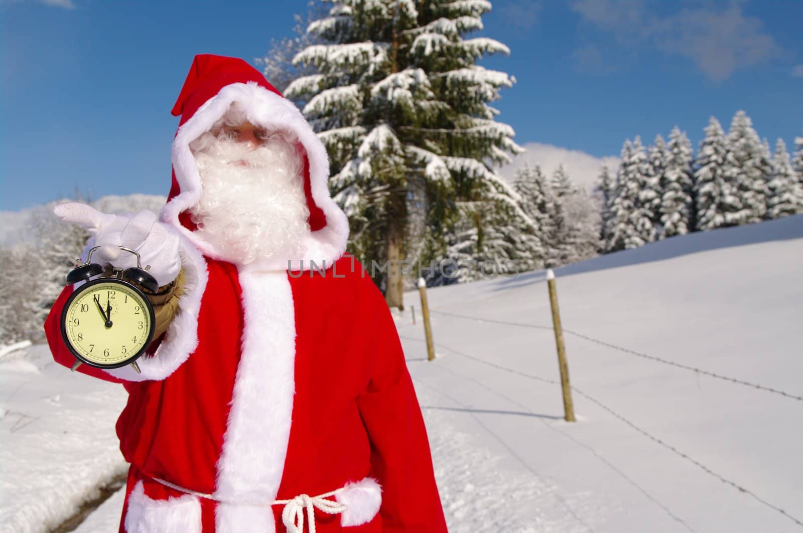 Santa Claus, Father Christmas holds watch clock