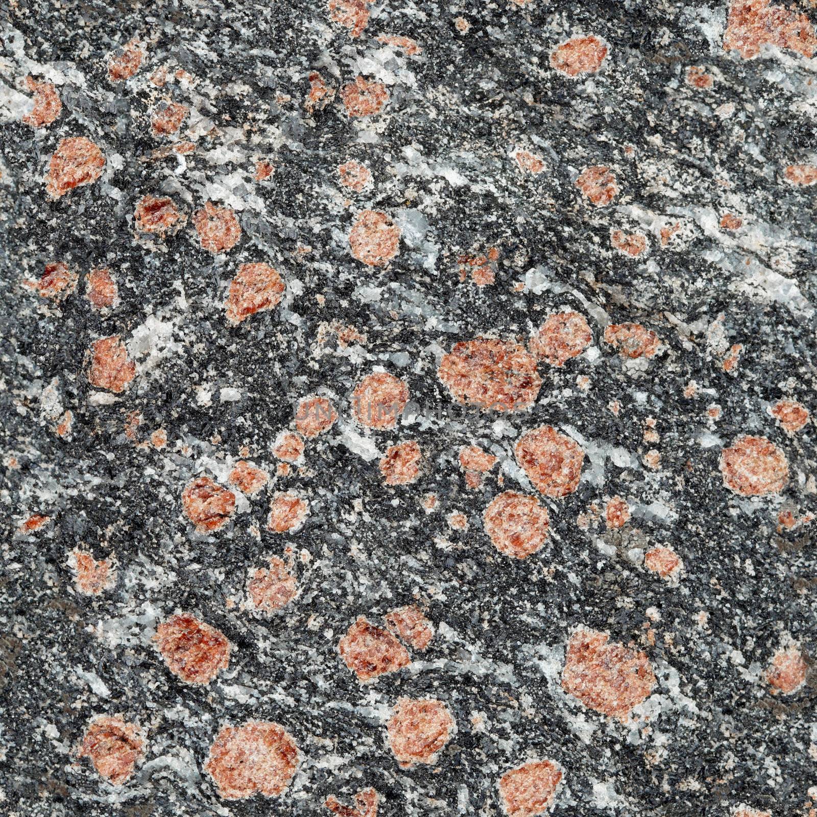 Seamless texture - dark stone surface with red minerals