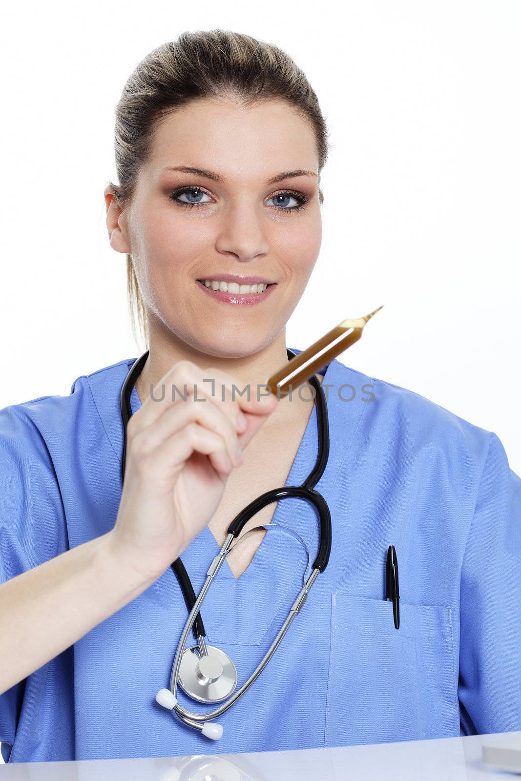woman doctor looks at an ampoule with a medicine 