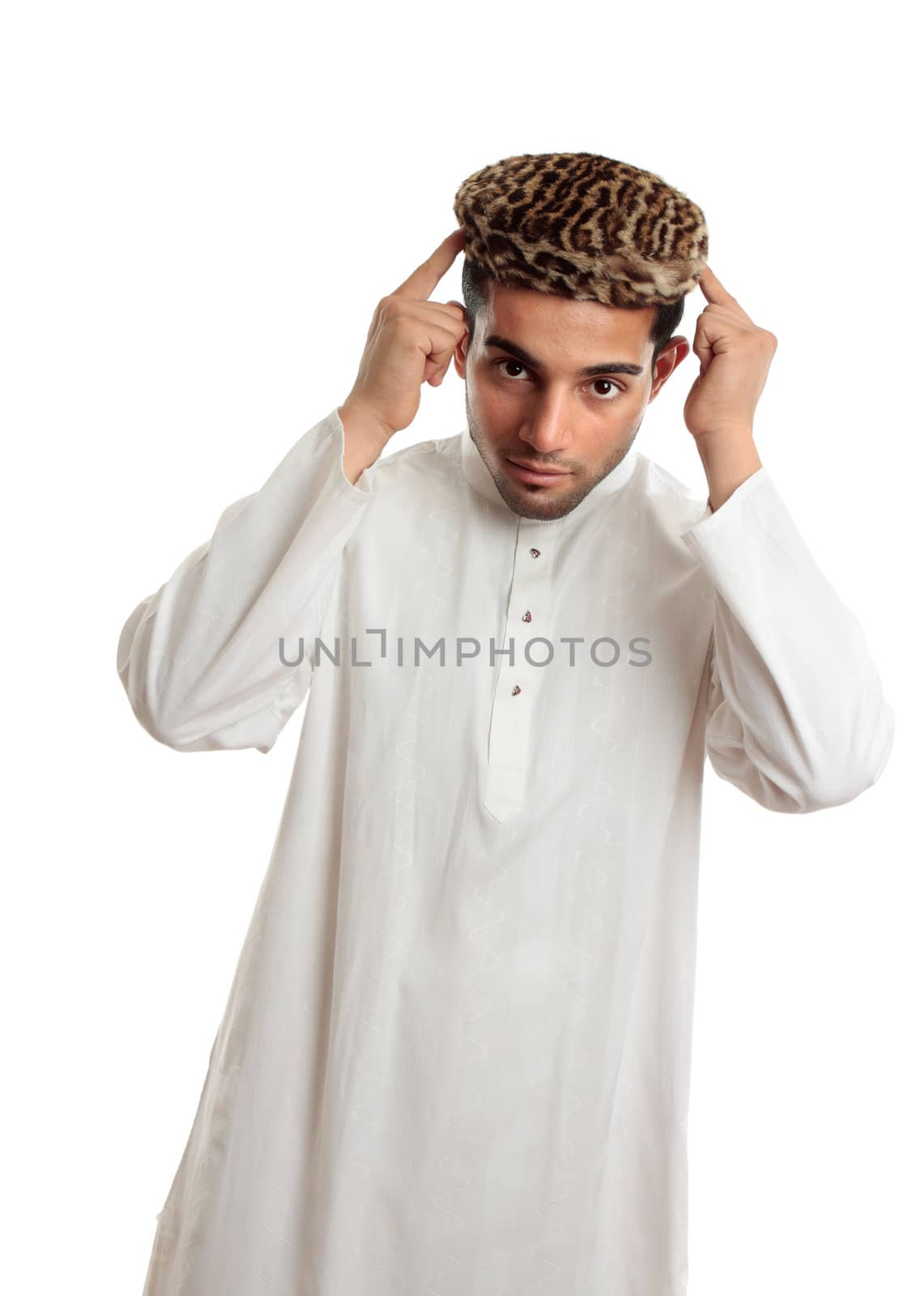 An ethnic man in white embroidered robe and a leopard fur topi hat.