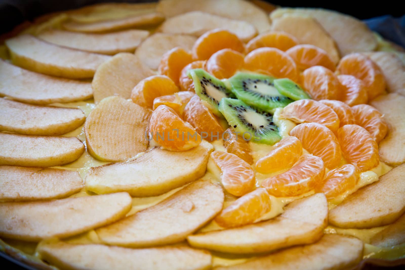 Fresh ingredients ready for a fruit cake: kiwi, apple and mandarin