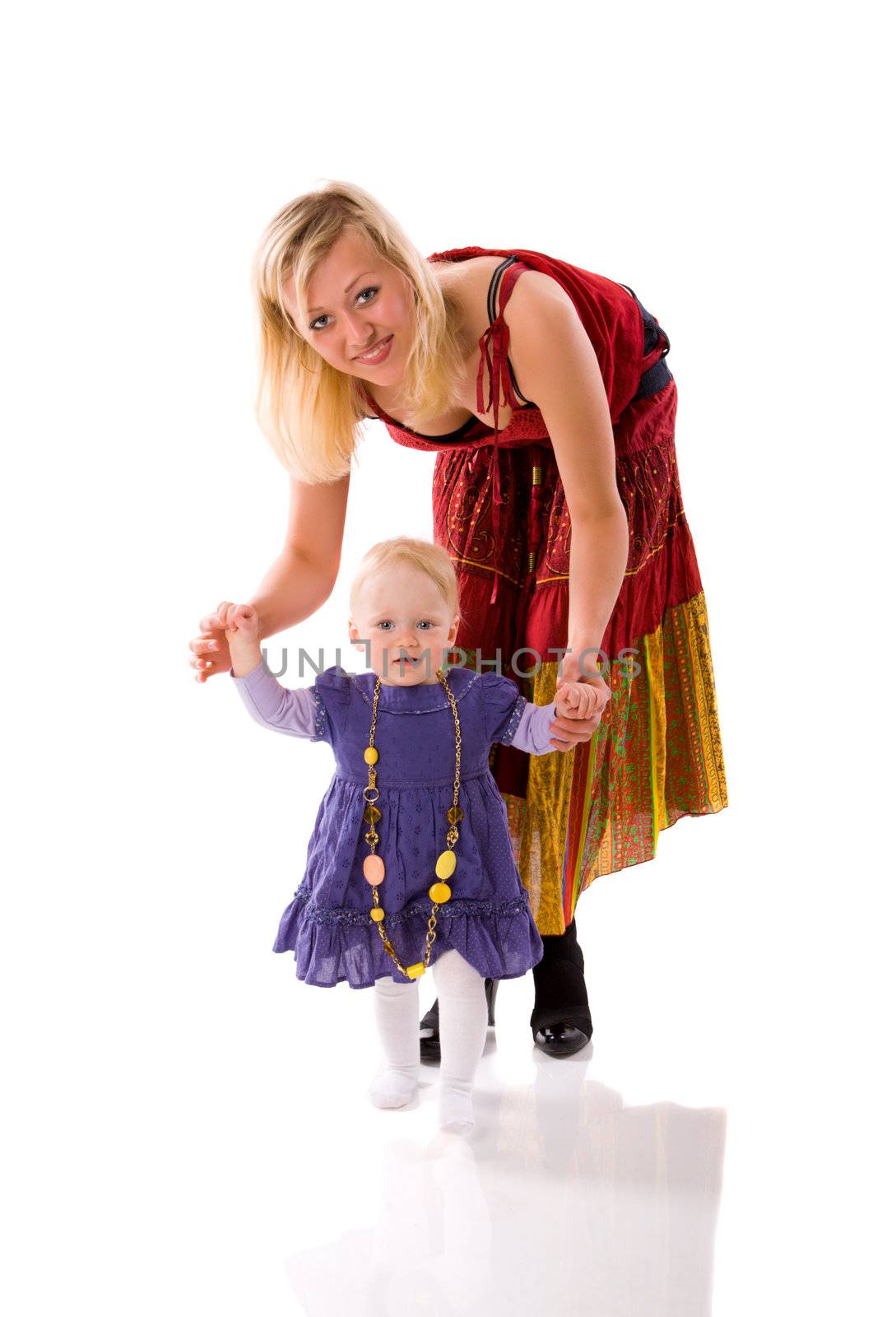 Mother and daughter enjoying First steps isolated on white