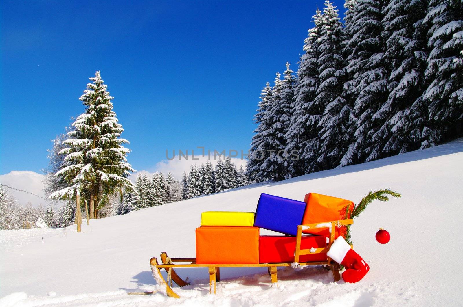 colorful presents on a Santa Claus sledge in a winter landscape