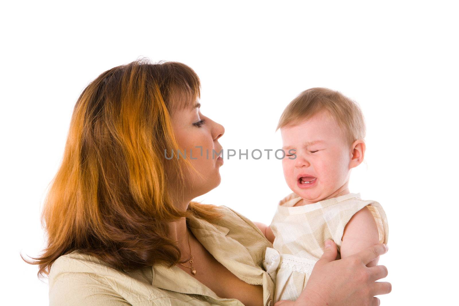 Mother holding crying baby one year age isolated on white