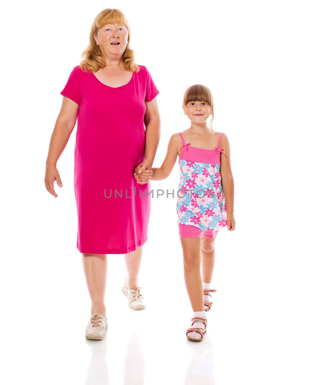 Grandmother with child walking together isolated on white