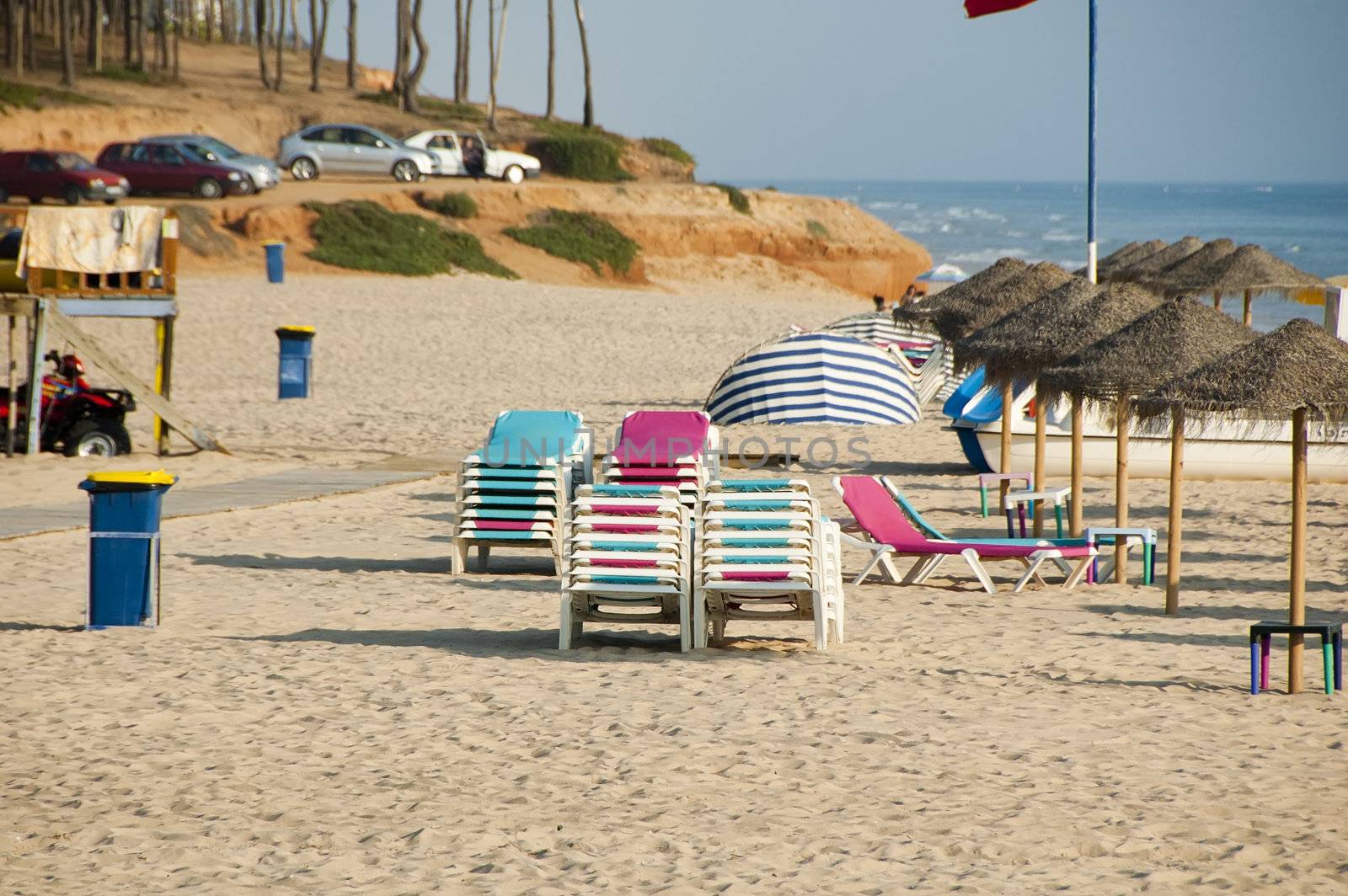 Shot of chaise longues and umbrellas on beach